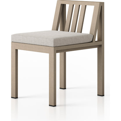 Monterey Outdoor Dining Chair by Four Hands in washed brown. Made from 100% olefin, solid fsc®-certified teak, 91% polyurethane foam pad, 9% polyester fiber batting in a modern style.