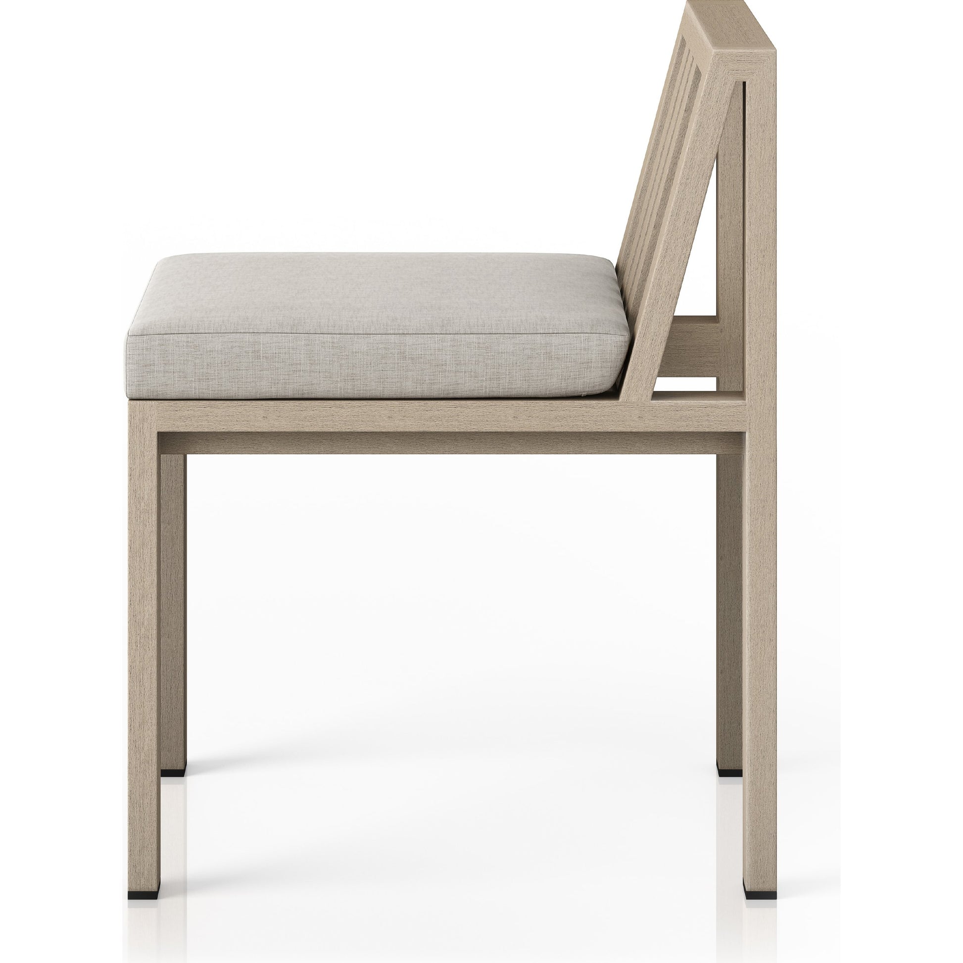 Monterey Outdoor Dining Chair by Four Hands in washed brown. Made from 100% olefin, solid fsc®-certified teak, 91% polyurethane foam pad, 9% polyester fiber batting in a modern style.