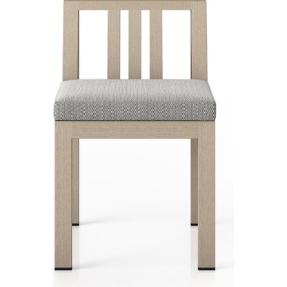 Monterey Outdoor Dining Chair by Four Hands in washed brown. Made from 100% olefin, solid fsc®-certified teak, 91% polyurethane foam pad, 9% polyester fiber batting in a modern style.