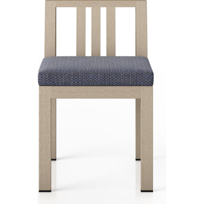 Monterey Outdoor Dining Chair by Four Hands in washed brown. Made from 100% olefin, solid fsc®-certified teak, 91% polyurethane foam pad, 9% polyester fiber batting in a modern style.