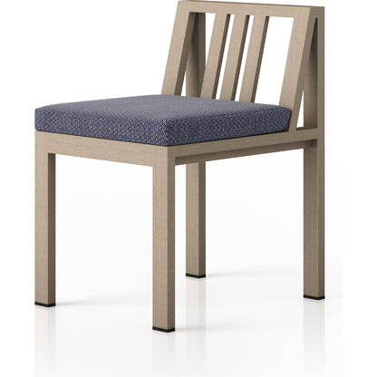 Monterey Outdoor Dining Chair by Four Hands in washed brown. Made from 100% olefin, solid fsc®-certified teak, 91% polyurethane foam pad, 9% polyester fiber batting in a modern style.