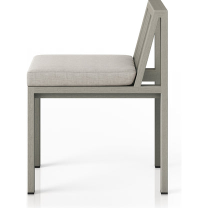 Monterey Outdoor Dining Chair by Four Hands in washed brown. Made from 100% olefin, solid fsc®-certified teak, 91% polyurethane foam pad, 9% polyester fiber batting in a modern style.