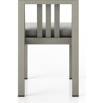 Monterey Outdoor Dining Chair by Four Hands in washed brown. Made from 100% olefin, solid fsc®-certified teak, 91% polyurethane foam pad, 9% polyester fiber batting in a modern style.