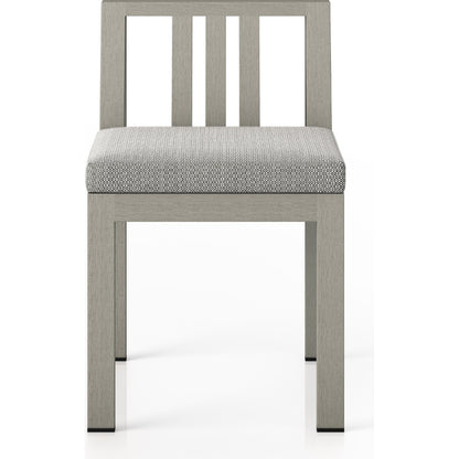 Monterey Outdoor Dining Chair by Four Hands in washed brown. Made from 100% olefin, solid fsc®-certified teak, 91% polyurethane foam pad, 9% polyester fiber batting in a modern style.