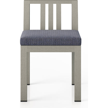 Monterey Outdoor Dining Chair by Four Hands in washed brown. Made from 100% olefin, solid fsc®-certified teak, 91% polyurethane foam pad, 9% polyester fiber batting in a modern style.