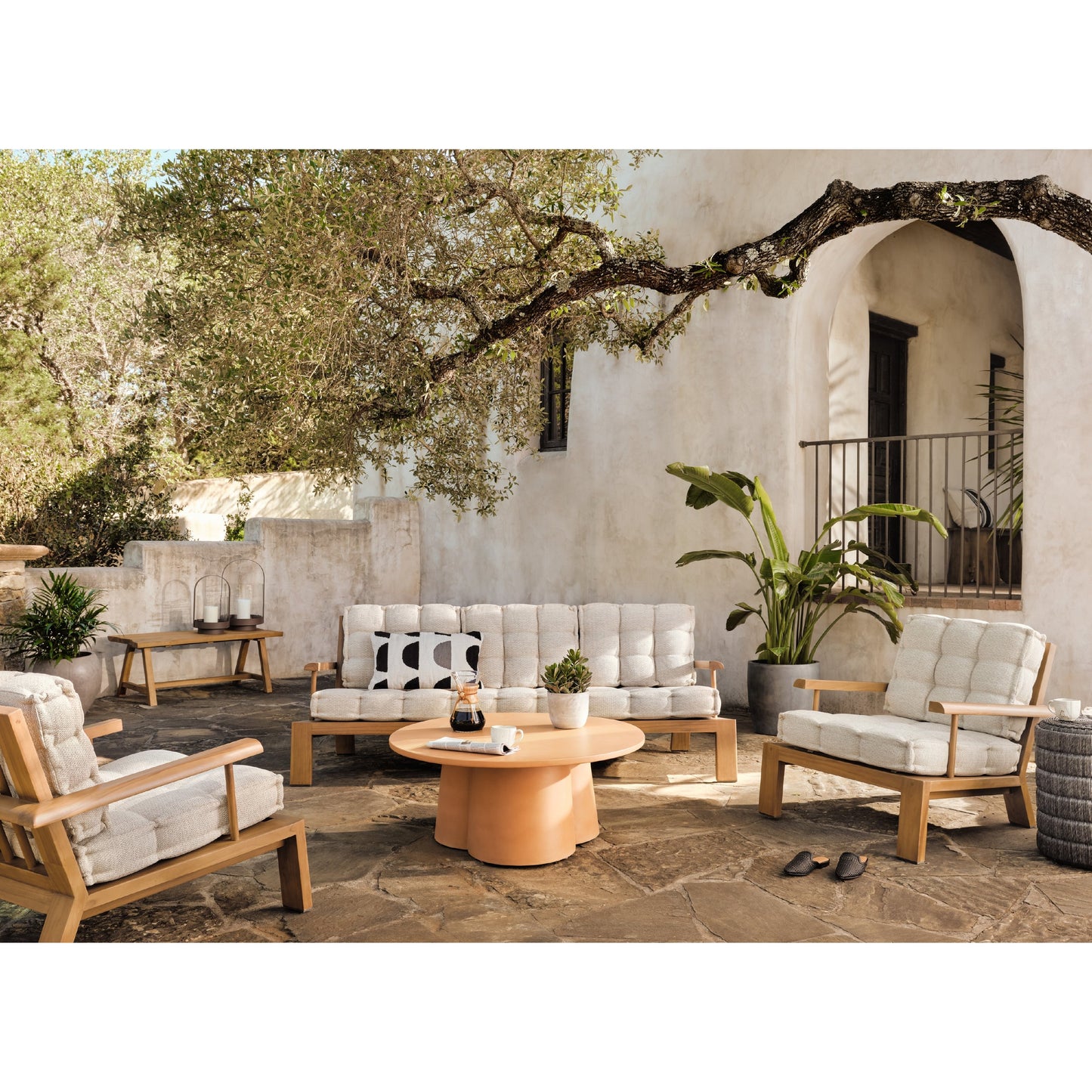 002 SI-1799392 | Lifestyle | Beck Outdoor Sofa by Four Hands in faye sand and natural teak. Made from 100% olefin, solid fsc®-certified teak, 91% polyurethane foam pad, 9% polyester fiber batting in a modern style.
