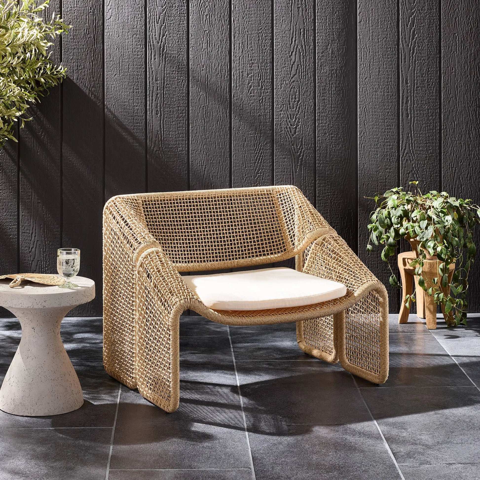 Selma Outdoor Chair by Four Hands. Made from 100% olefin, 100% polyethylene, 91% polyurethane foam pad, 9% polyester fiber batting in a coastal style.
