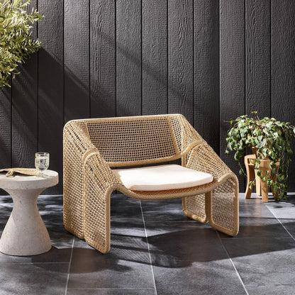 Selma Outdoor Chair by Four Hands. Made from 100% olefin, 100% polyethylene, 91% polyurethane foam pad, 9% polyester fiber batting in a coastal style.