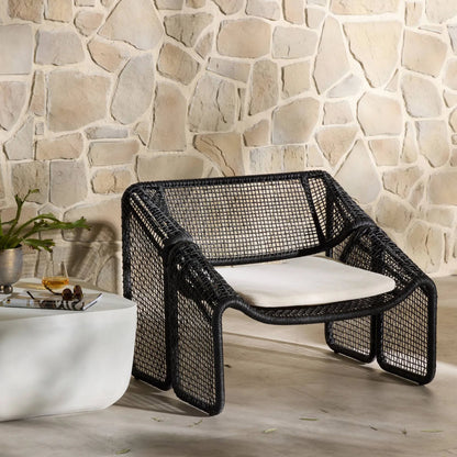 Selma Outdoor Chair by Four Hands. Made from 100% olefin, 100% polyethylene, 91% polyurethane foam pad, 9% polyester fiber batting in a coastal style.