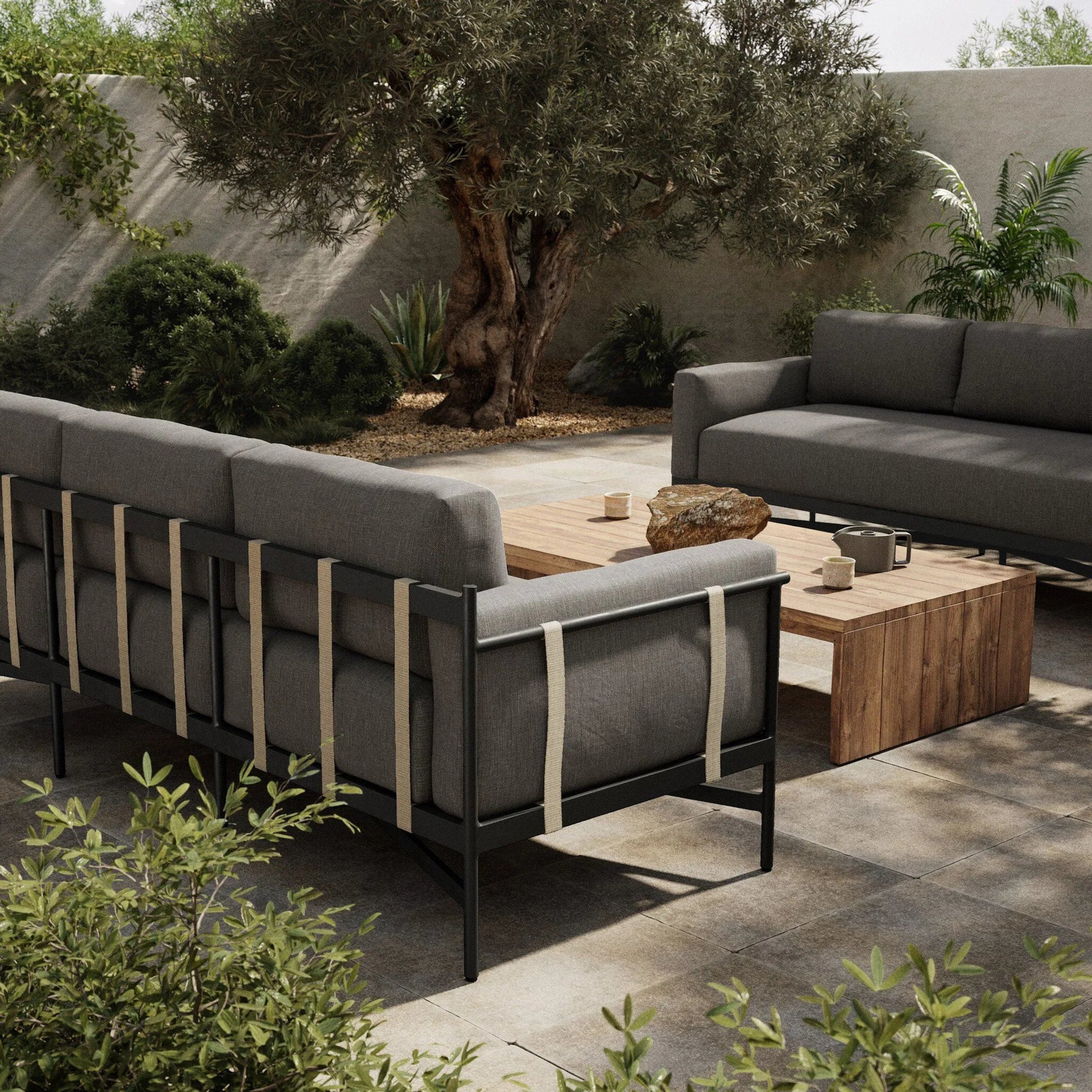 Hearst 99" Outdoor Sofa by Four Hands in bronze. Made from 100% olefin, aluminum, 100% polypropylene in a modern style.