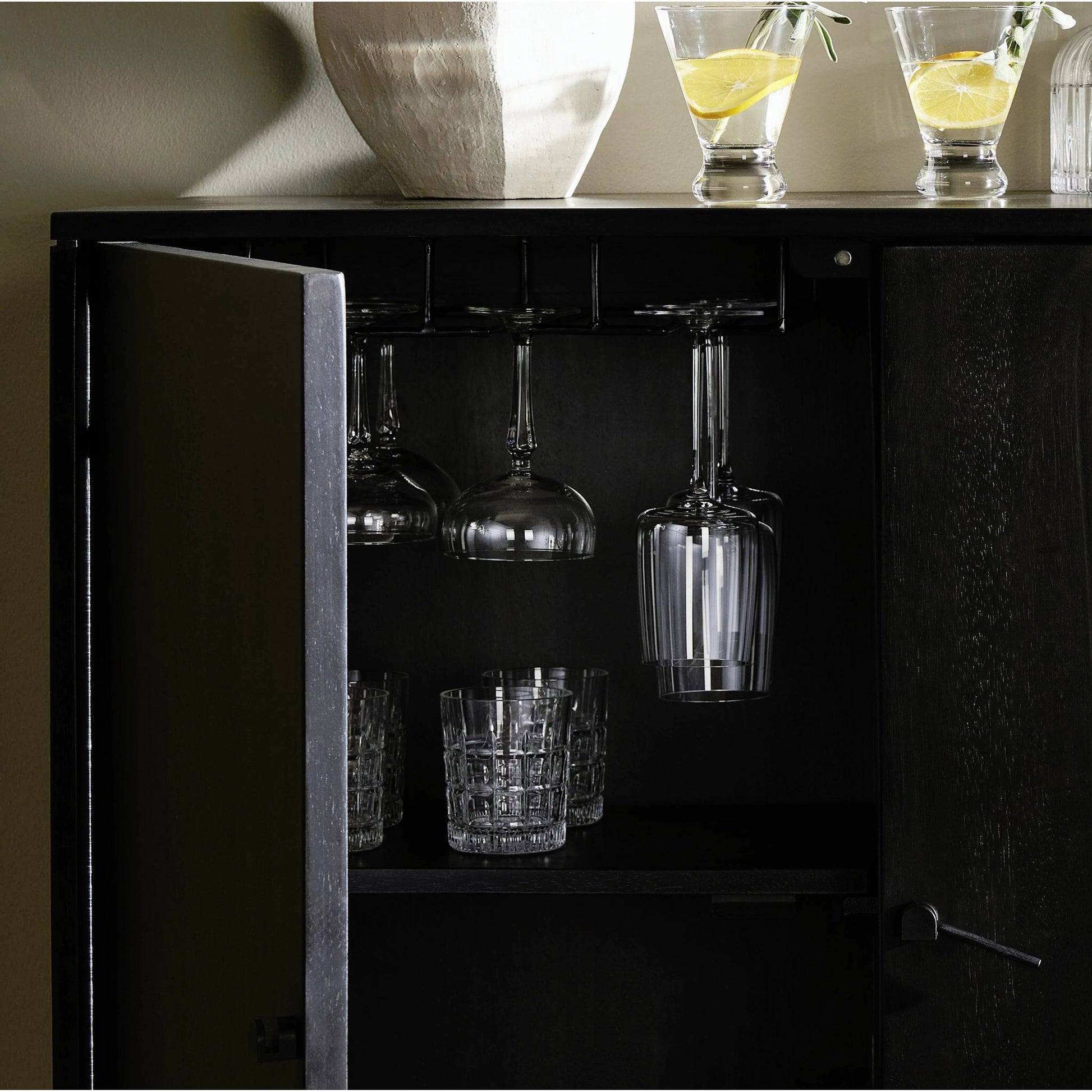 Reza Bar Cabinet by Four Hands in smoked honey parawood. Made from solid parawood, brass, solid acacia in a transitional style.