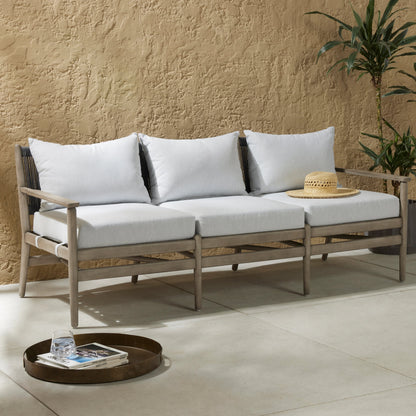 Rosen Outdoor Sofa by Four Hands in lakin oat, natural eucalyptus fsc, natural rope. Made from 100% olefin, solid fsc®-certified eucalyptus, 98% polypropylene, 2% polyester in a coastal style.