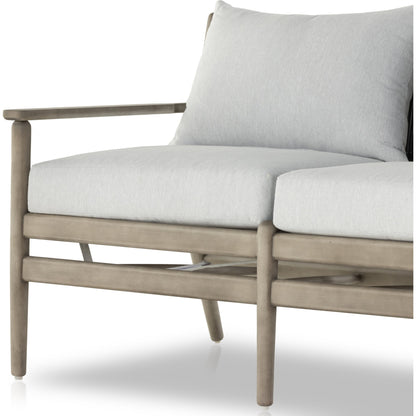 Rosen Outdoor Sofa by Four Hands in lakin oat, natural eucalyptus fsc, natural rope. Made from 100% olefin, solid fsc®-certified eucalyptus, 98% polypropylene, 2% polyester in a coastal style.