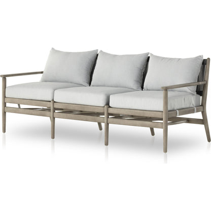 Rosen Outdoor Sofa by Four Hands in lakin oat, natural eucalyptus fsc, natural rope. Made from 100% olefin, solid fsc®-certified eucalyptus, 98% polypropylene, 2% polyester in a coastal style.