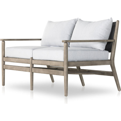 Rosen Outdoor Sofa by Four Hands in lakin oat, natural eucalyptus fsc, natural rope. Made from 100% olefin, solid fsc®-certified eucalyptus, 98% polypropylene, 2% polyester in a coastal style.