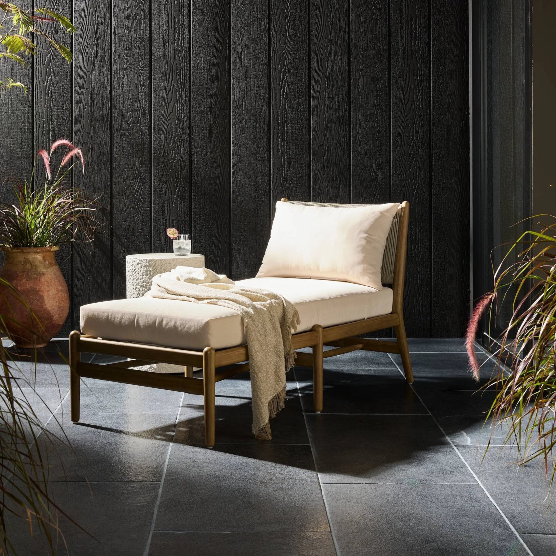 Rosen Outdoor Chaise by Four Hands in lakin oat, natural eucalyptus fsc, natural rope. Made from 100% olefin, solid fsc®-certified eucalyptus, 98% polypropylene, 2% polyester in a coastal style.