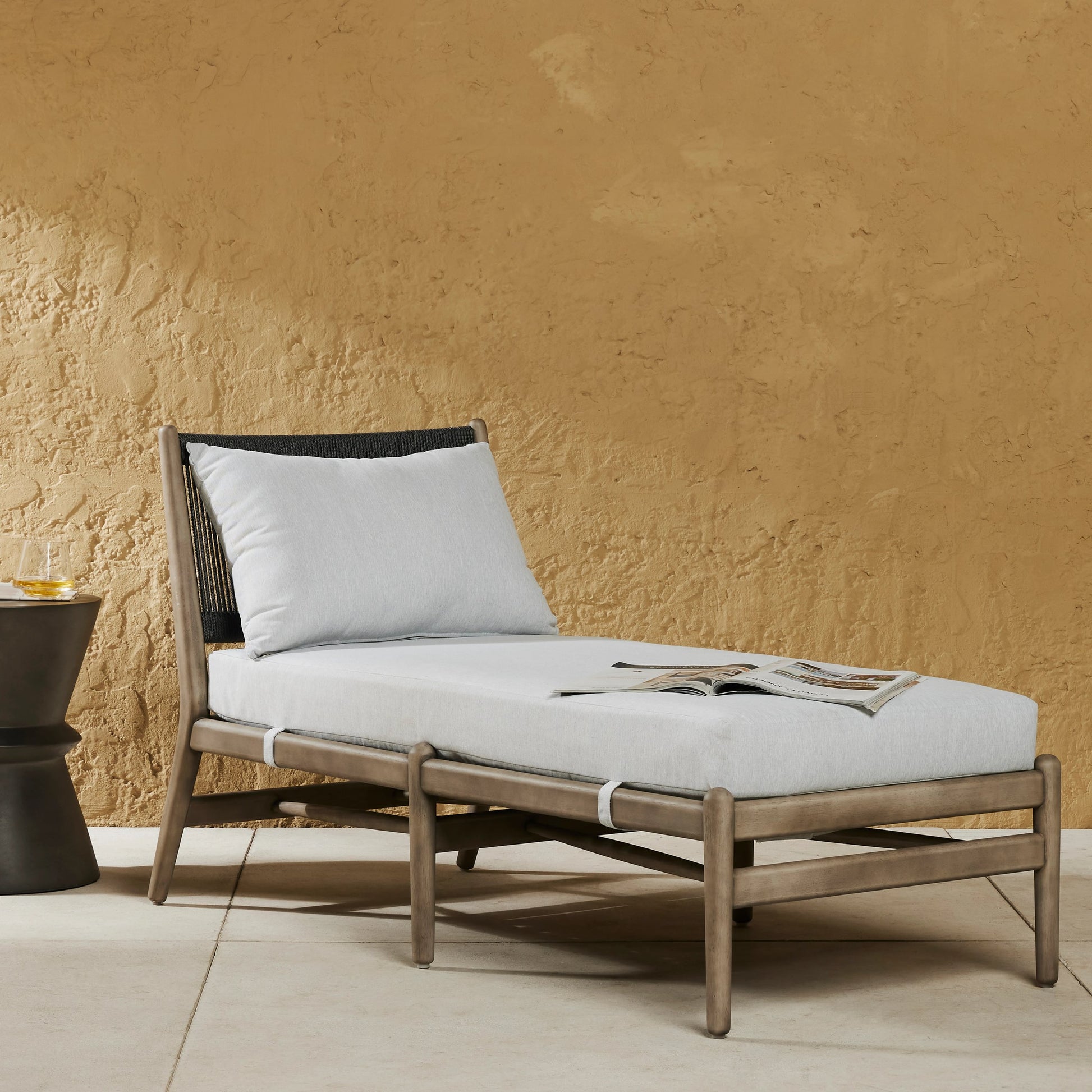 Rosen Outdoor Chaise by Four Hands in lakin oat, natural eucalyptus fsc, natural rope. Made from 100% olefin, solid fsc®-certified eucalyptus, 98% polypropylene, 2% polyester in a coastal style.