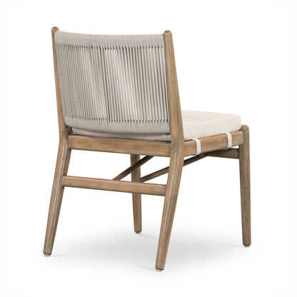 Rosen Outdoor Dining Chair by Four Hands in lakin oat. Made from 100% olefin, solid fsc®-certified eucalyptus, 98% polypropylene, 2% polyester in a coastal style.