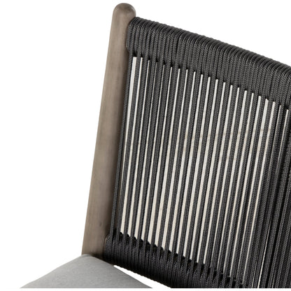 Rosen Outdoor Dining Chair by Four Hands in lakin oat. Made from 100% olefin, solid fsc®-certified eucalyptus, 98% polypropylene, 2% polyester in a coastal style.