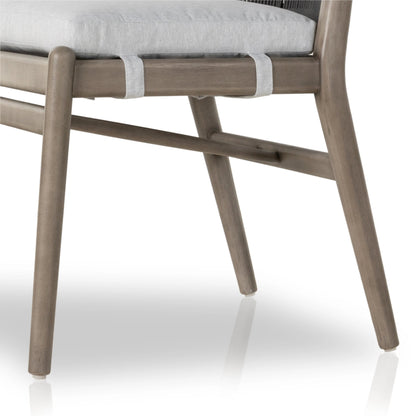 Rosen Outdoor Dining Chair by Four Hands in lakin oat. Made from 100% olefin, solid fsc®-certified eucalyptus, 98% polypropylene, 2% polyester in a coastal style.