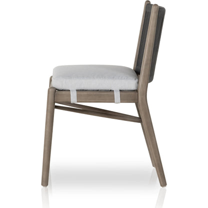 Rosen Outdoor Dining Chair by Four Hands in lakin oat. Made from 100% olefin, solid fsc®-certified eucalyptus, 98% polypropylene, 2% polyester in a coastal style.