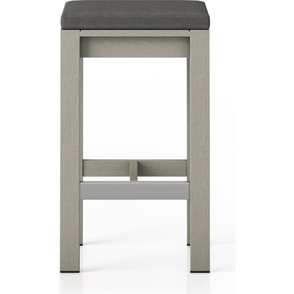 Monterey Bar Stool by Four Hands in faye navy and weathered grey. Made from 100% olefin, solid fsc®-certified teak, 91% polyurethane foam pad, 9% polyester fiber batting in a modern style.