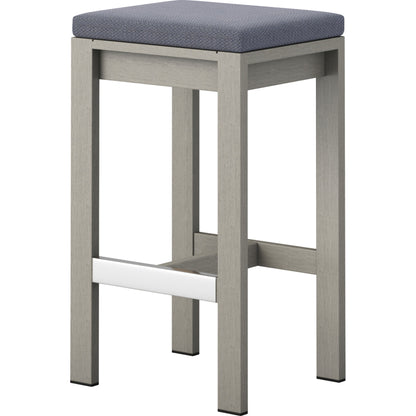 Monterey Bar Stool by Four Hands in faye navy and weathered grey. Made from 100% olefin, solid fsc®-certified teak, 91% polyurethane foam pad, 9% polyester fiber batting in a modern style.