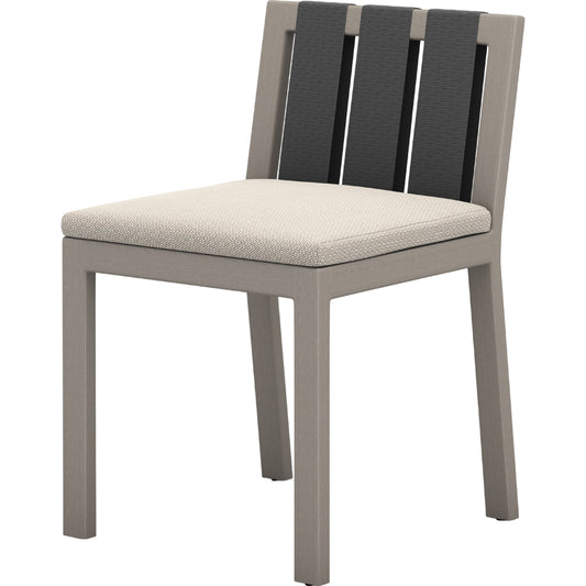 Sonoma Outdoor Dining Chair by Four Hands in faye sand and weathered grey. Made from 100% olefin, solid fsc®-certified teak, 100% polypropylene in a modern style.