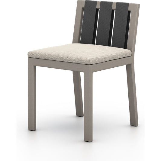 Sonoma Outdoor Dining Chair by Four Hands in faye sand and weathered grey. Made from 100% olefin, solid fsc®-certified teak, 100% polypropylene in a modern style.