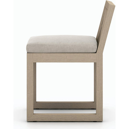 Avalon Outdoor Armless Dining Chair by Four Hands in charcoal / grey. Made from 100% olefin, solid fsc®-certified teak, 91% polyurethane foam pad, 9% polyester fiber batting in a modern style.