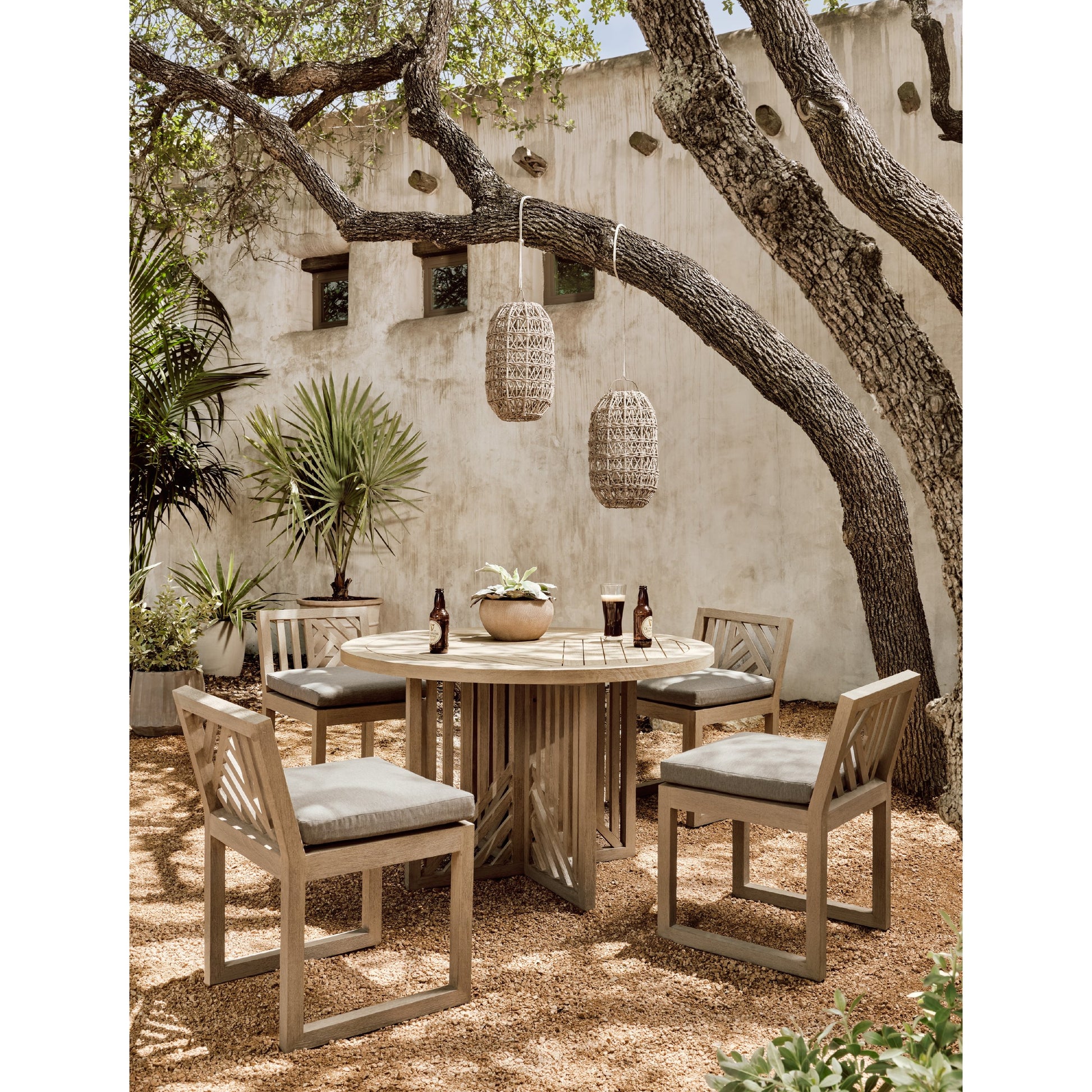 Avalon Outdoor Armless Dining Chair by Four Hands in charcoal / grey. Made from 100% olefin, solid fsc®-certified teak, 91% polyurethane foam pad, 9% polyester fiber batting in a modern style.