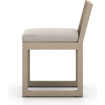 Avalon Outdoor Armless Dining Chair by Four Hands in charcoal / grey. Made from 100% olefin, solid fsc®-certified teak, 91% polyurethane foam pad, 9% polyester fiber batting in a modern style.