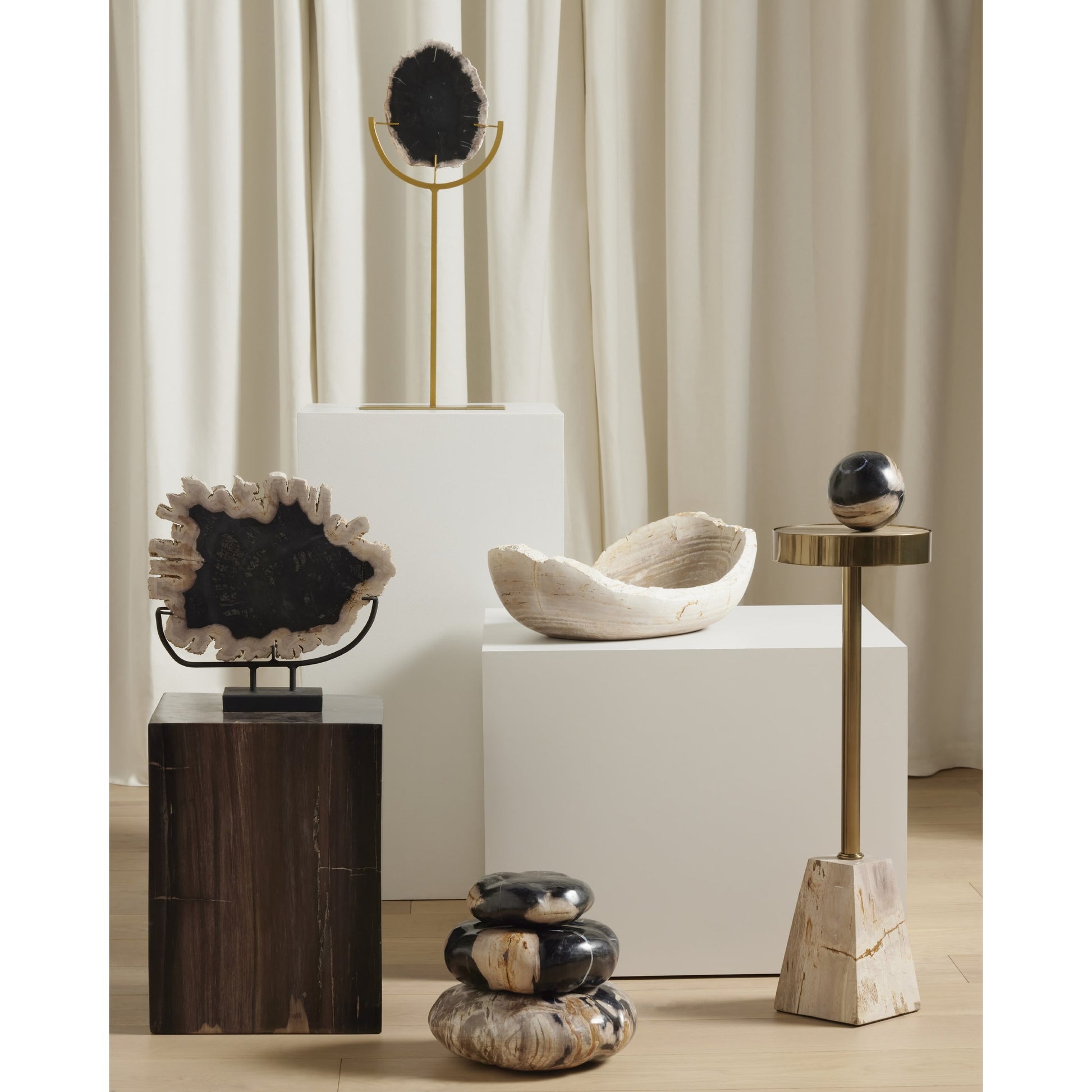 Galen End Table by Four Hands in dark petrified wood, shiny brass. Made from petrified wood, stainless steel in a modern style.