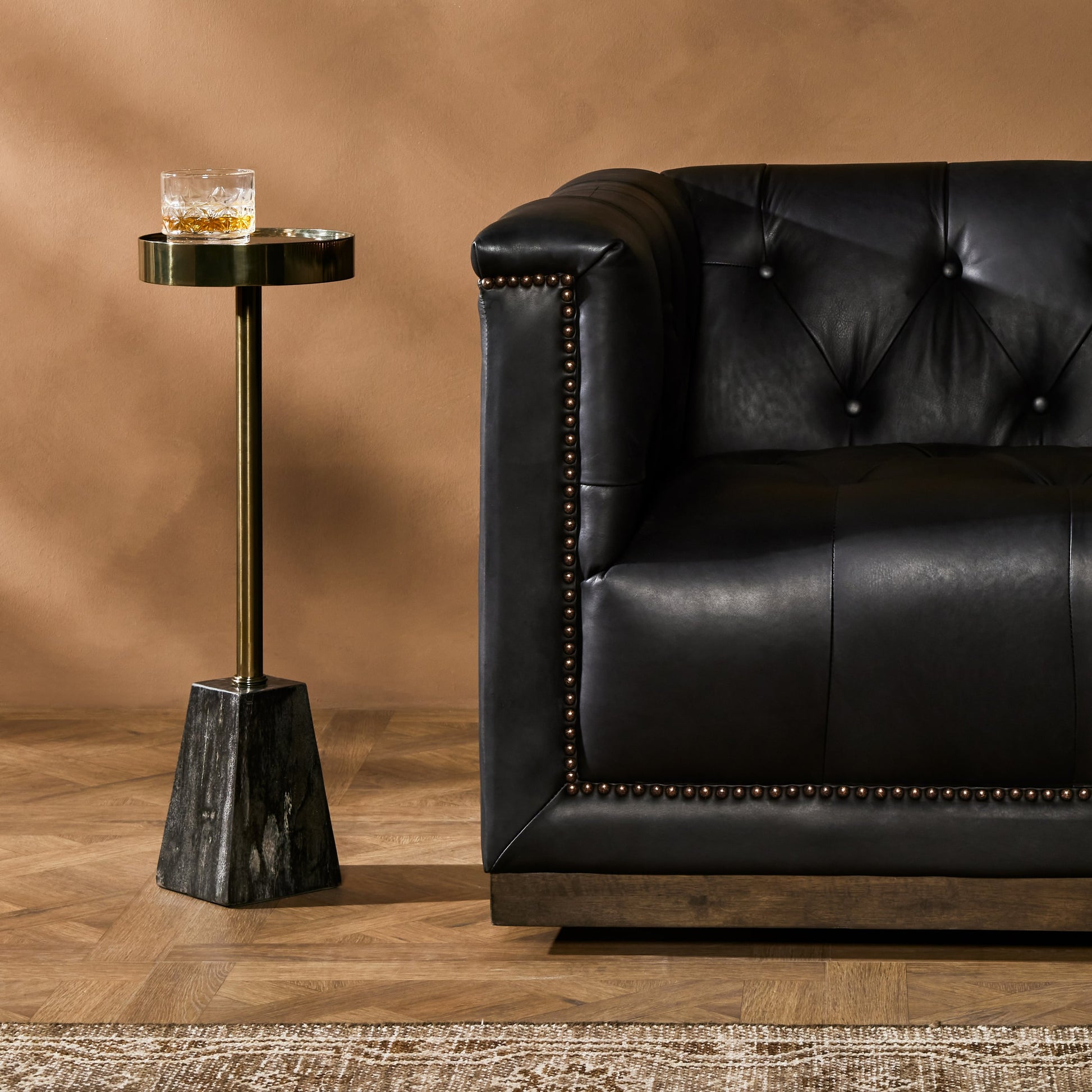 Galen End Table by Four Hands in dark petrified wood, shiny brass. Made from petrified wood, stainless steel in a modern style.