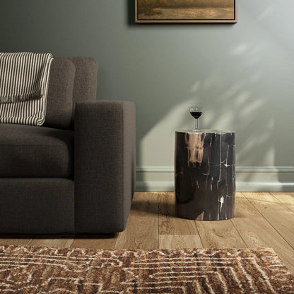 Kos End Table by Four Hands. Made from petrified wood in a modern style.