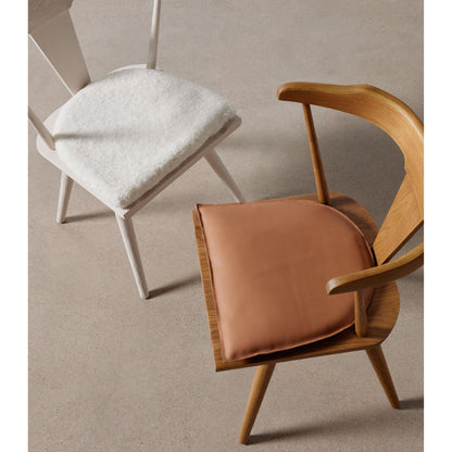 Lewis & Ripley Seat Cushion by Four Hands in whiskey saddle. Made from top grain leather, 100% cotton, 90% polyurethane foam pad, 10% polyester fiber batting in a rustic style.