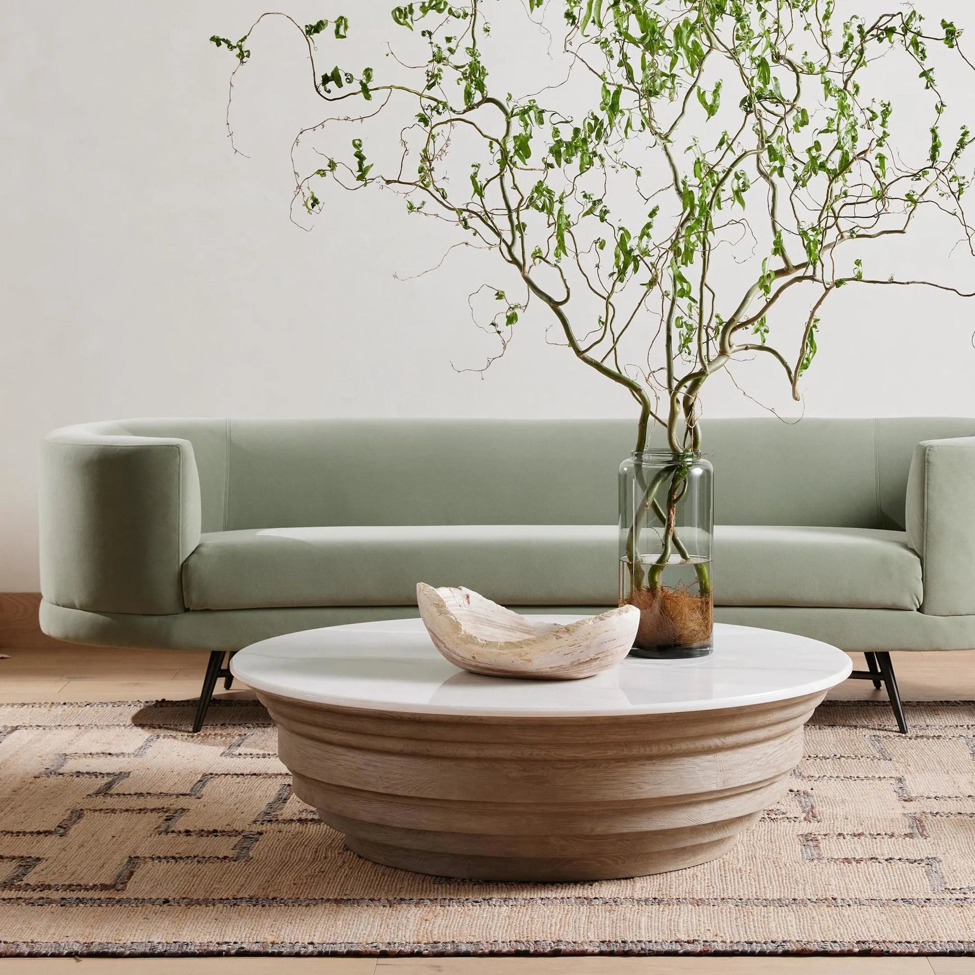 Caldwell Stone Coffee Table by Four Hands in weathered blonde pine, white marble and white marble. Made from solid marble, solid pine, poplar plywood in a cottage & farmhouse style.