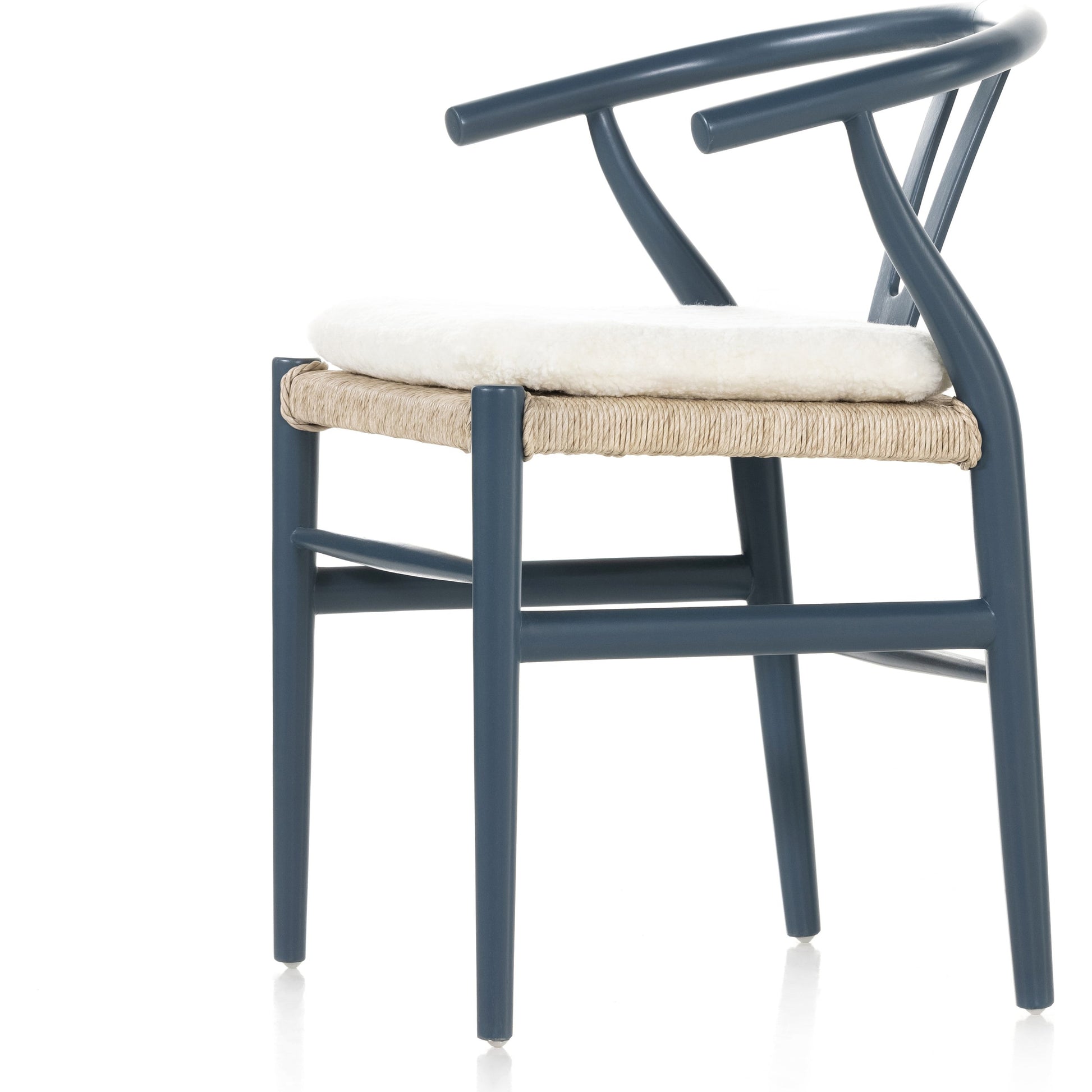 Muestra Dining Chair by Four Hands. Made from solid teak, 100% polyethylene in a coastal style.