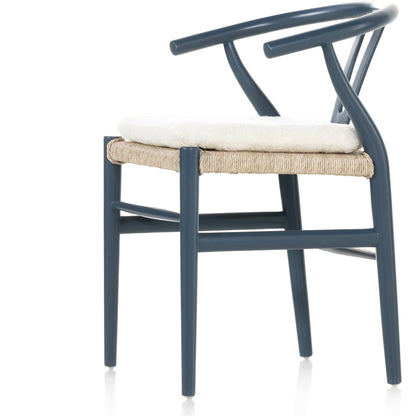 Muestra Dining Chair by Four Hands. Made from solid teak, 100% polyethylene in a coastal style.