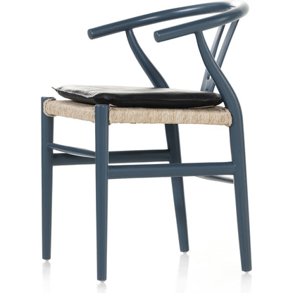 Muestra Dining Chair by Four Hands. Made from solid teak, 100% polyethylene in a coastal style.