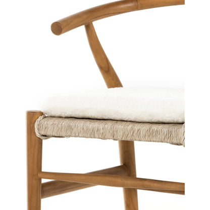 Muestra Dining Chair by Four Hands. Made from solid teak, 100% polyethylene in a coastal style.