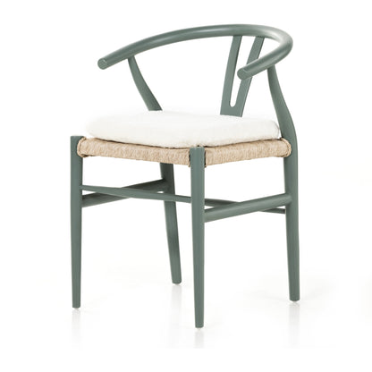 Muestra Dining Chair by Four Hands. Made from solid teak, 100% polyethylene in a coastal style.