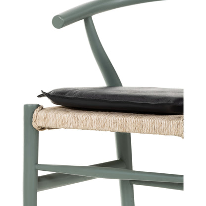 Muestra Dining Chair by Four Hands. Made from solid teak, 100% polyethylene in a coastal style.