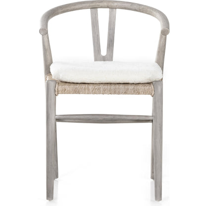 Muestra Dining Chair by Four Hands. Made from solid teak, 100% polyethylene in a coastal style.