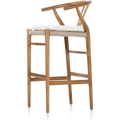 Muestra Bar Stool by Four Hands in vintage white, natural teak. Made from solid teak, 100% polyethylene in a coastal style.