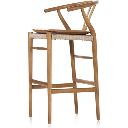 Muestra Bar Stool by Four Hands in vintage white, natural teak. Made from solid teak, 100% polyethylene in a coastal style.