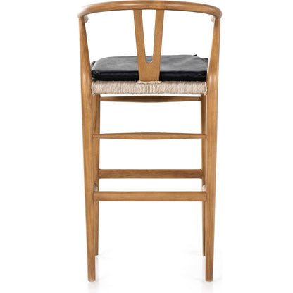 Muestra Bar Stool by Four Hands in vintage white, natural teak. Made from solid teak, 100% polyethylene in a coastal style.