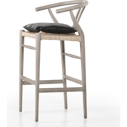 Muestra Bar Stool by Four Hands in vintage white, natural teak. Made from solid teak, 100% polyethylene in a coastal style.