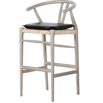 Muestra Bar Stool by Four Hands in vintage white, natural teak. Made from solid teak, 100% polyethylene in a coastal style.