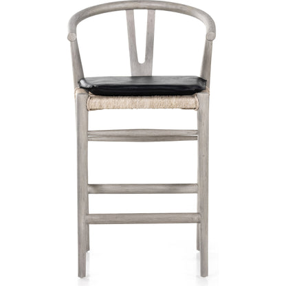 Muestra Counter Stool by Four Hands in vintage white, black teak. Made from solid teak, 100% polyethylene in a coastal style.